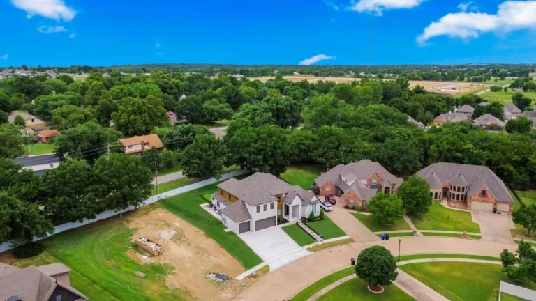 drone shot of newly remodeled home with new construction happening next door